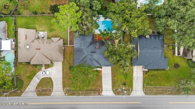 a kitchen with a sink a counter top space stainless steel appliances and cabinets