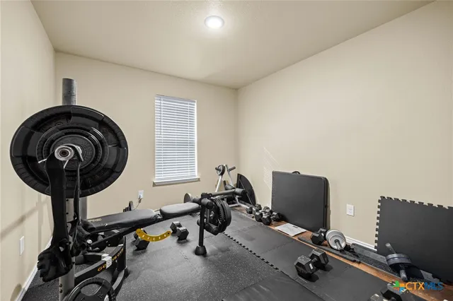 a bedroom with a bed and a television