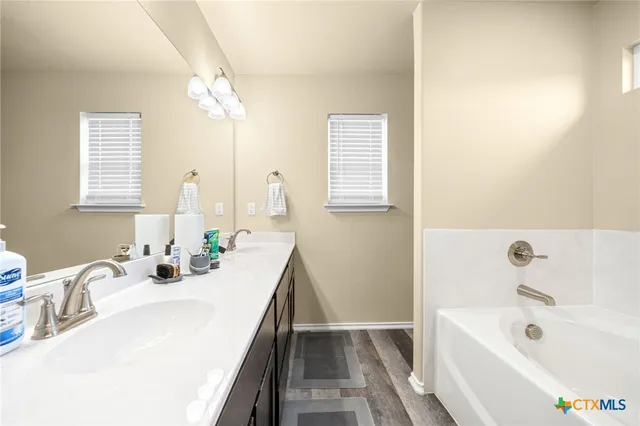 a picture of a bathroom with a sink