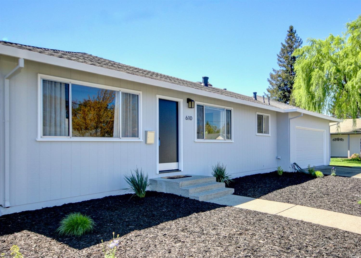 610 Trowbridge Street Santa Rosa, CA 95401 - Photo 1 of 1 a front view of a house with a yard