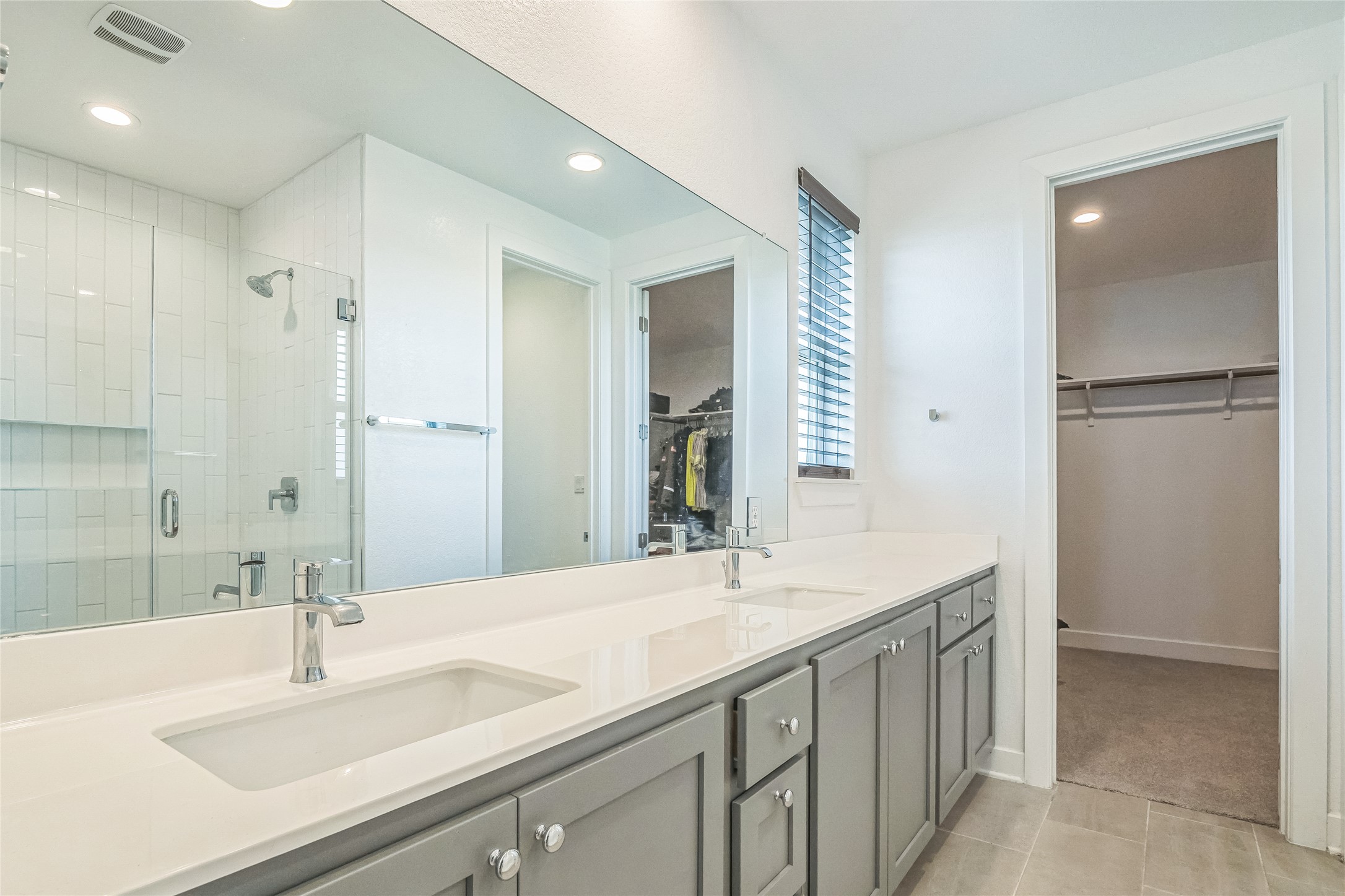 3706 Mesquite Vly Road Georgetown, TX 78628 - Photo 22 of 30 Bathroom featuring a shower stall, recessed lighting, tile patterned floors, double vanity, and a walk in closet