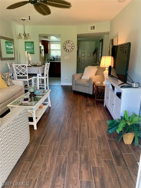 16881 Davis Road, Unit 216 Fort Myers, FL 33908 - Photo 13 of 26 a living room with furniture and wooden floor