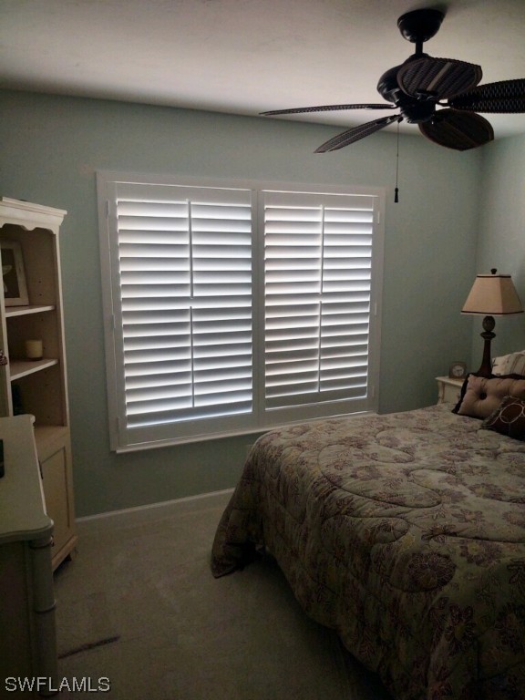 16881 Davis Road, Unit 216 Fort Myers, FL 33908 - Photo 15 of 26 a bedroom with a bed and a window