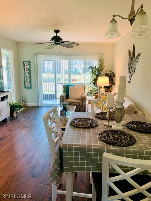 16881 Davis Road, Unit 216 Fort Myers, FL 33908 - Photo 16 of 26 a living room with furniture a large window and wooden floor