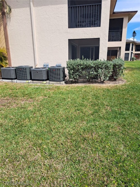 16881 Davis Road, Unit 216 Fort Myers, FL 33908 - Photo 21 of 26 a front view of a house with a garden