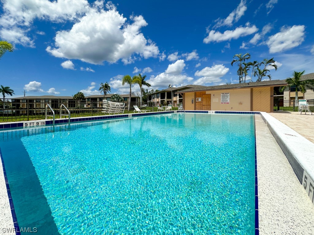 16881 Davis Road, Unit 216 Fort Myers, FL 33908 - Photo 24 of 26 a view of a house with a yard