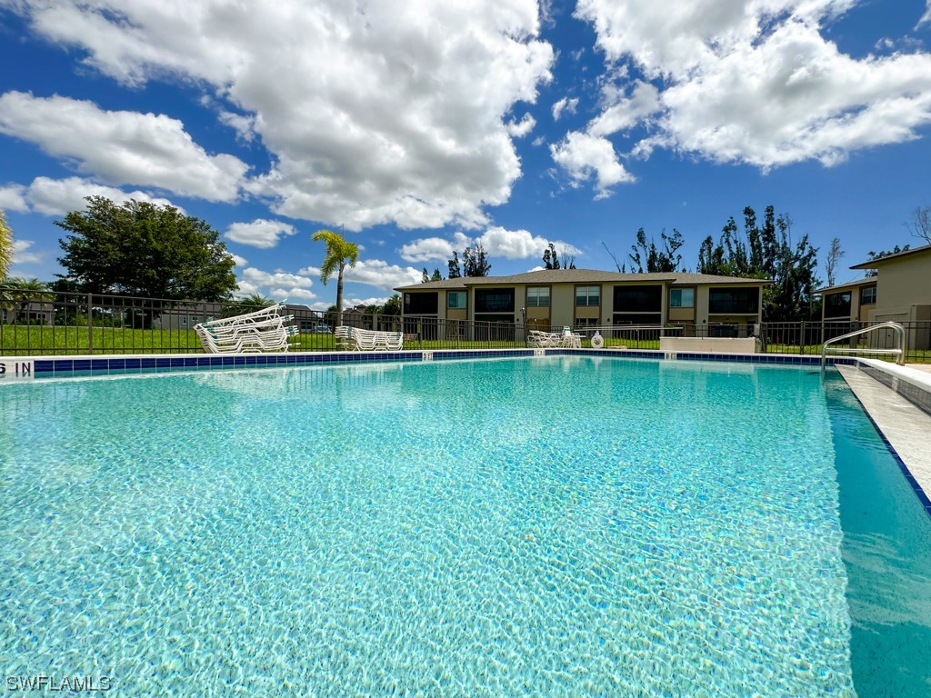 16881 Davis Road, Unit 216 Fort Myers, FL 33908 - Photo 26 of 26 a view of a swimming pool is middle in the garden
