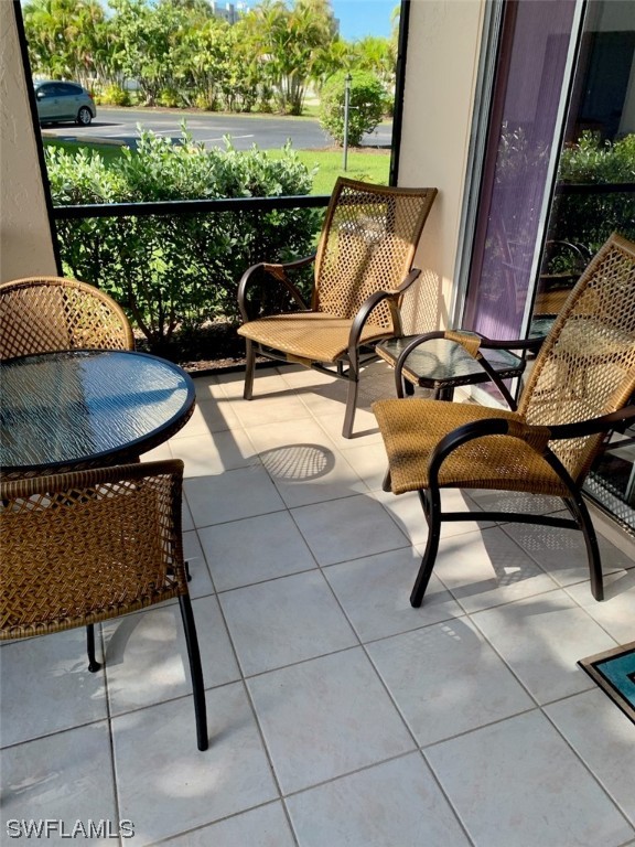 16881 Davis Road, Unit 216 Fort Myers, FL 33908 - Photo 3 of 26 a view of a chairs and table in terrace