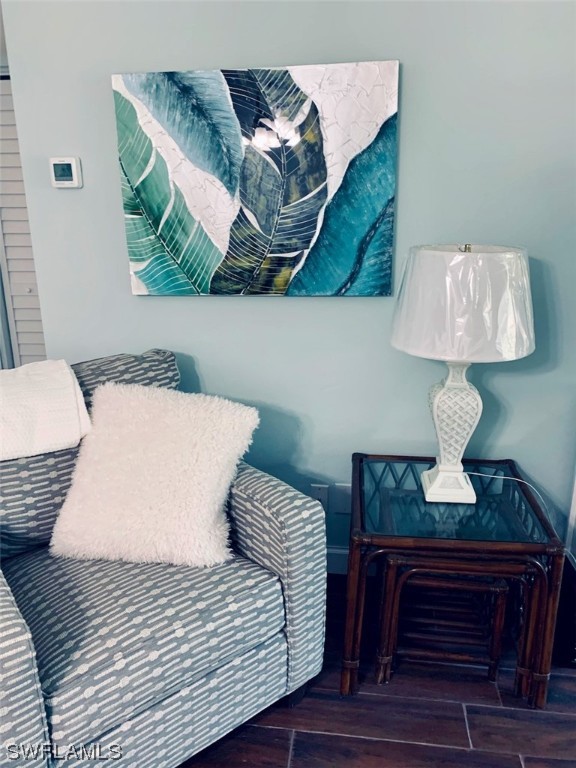 16881 Davis Road, Unit 216 Fort Myers, FL 33908 - Photo 6 of 26 a bedroom with a bed and a lamp on dresser