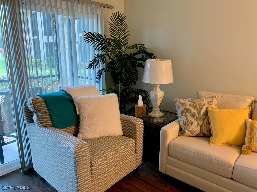 16881 Davis Road, Unit 216 Fort Myers, FL 33908 - Photo 8 of 26 a living room with furniture and a window