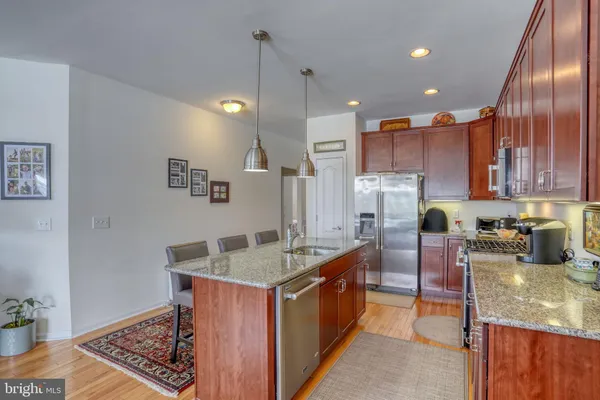 a living room with fireplace furniture and a flat screen tv