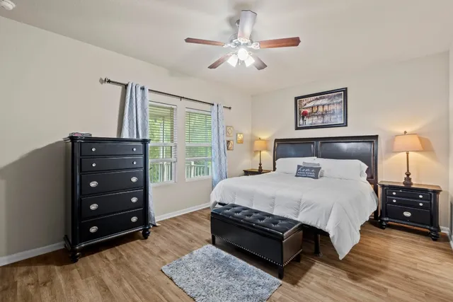 a bedroom with a bed and a dresser