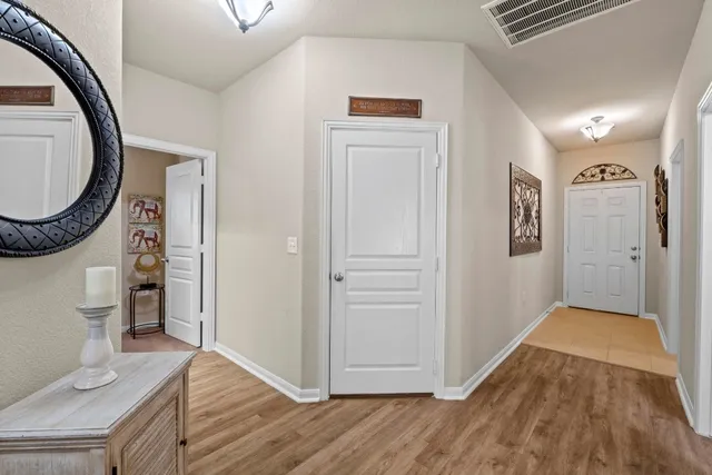 wooden floor with white walls