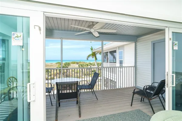 a view of a balcony with furniture