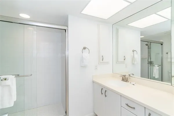 a bathroom with a sink and mirror