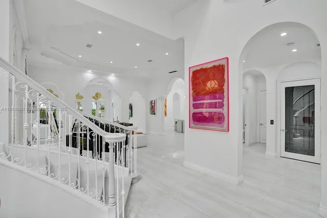 a living room with furniture and a gym