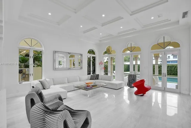 a front view of a building with streets and trees