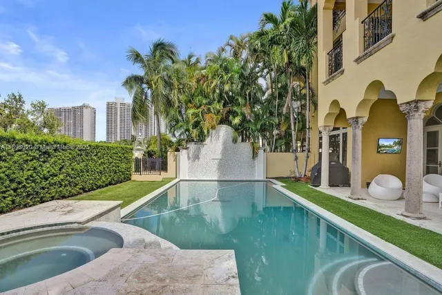 a view of a backyard with sitting area