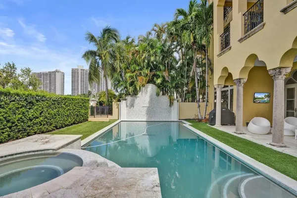 a view of a backyard with sitting area