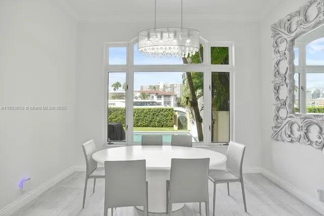 a view of a bedroom with baby bed and hallway