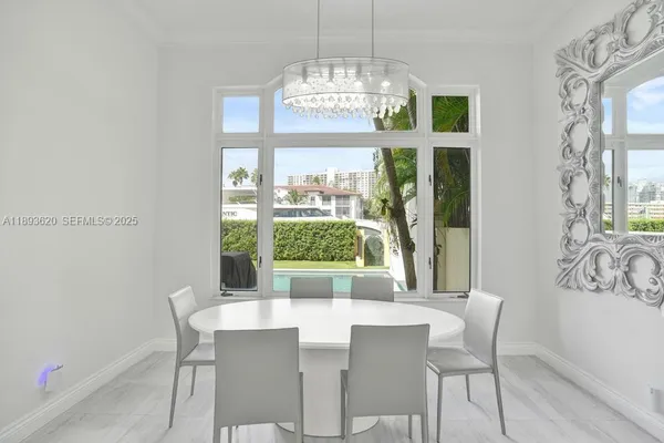a bedroom with furniture and a chandelier