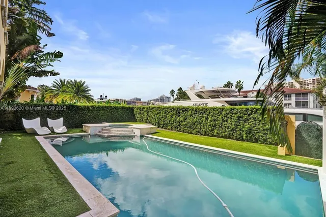 a view of a patio with table and chairs potted plants
