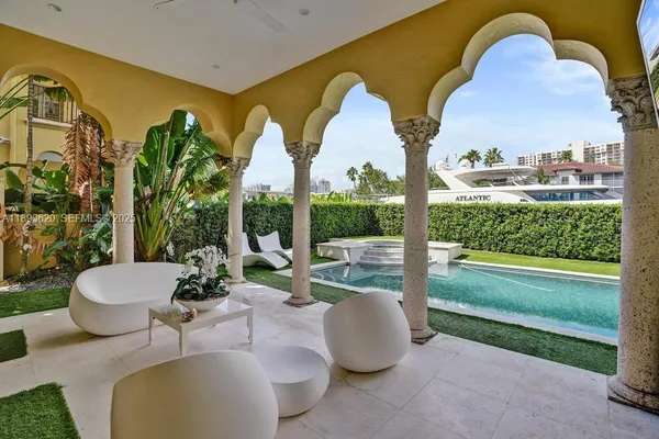 an aerial view of multiple houses with yard