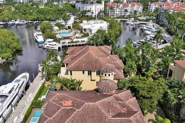 an aerial view of a house with swimming pool and outdoor space