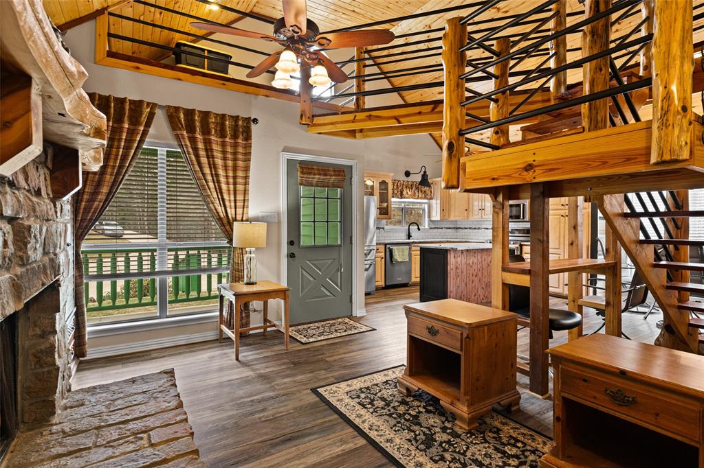 5066 Bob O Link Road Gilmer, TX 75645 - Photo 8 of 30 a balcony with furniture and wooden floor