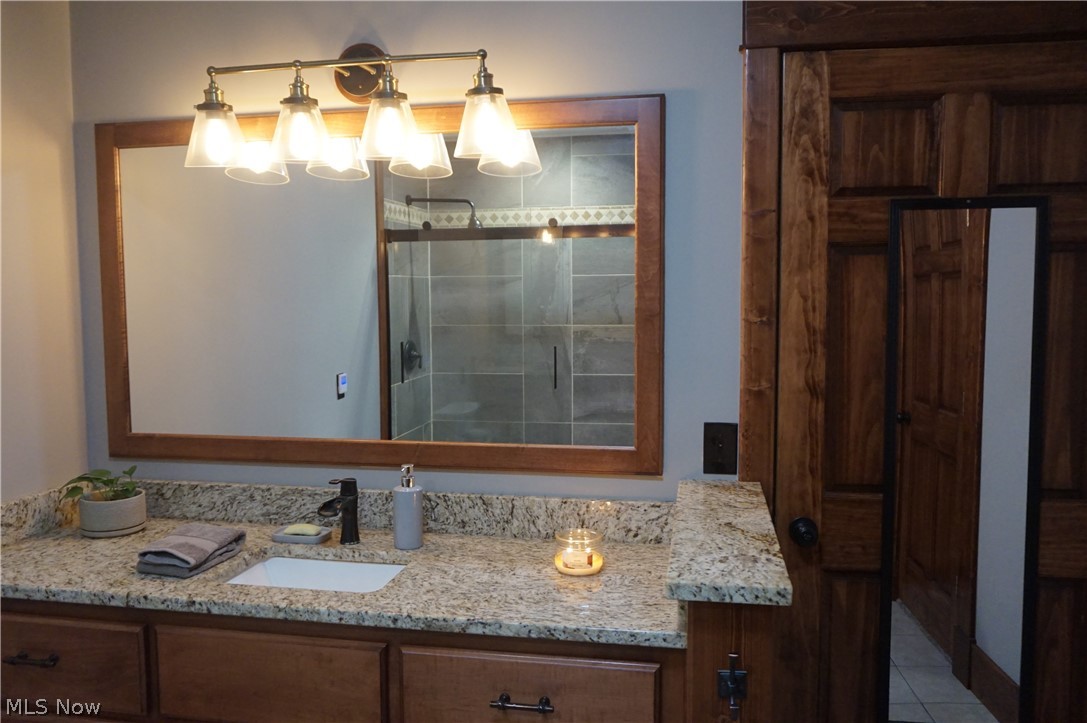 2605 Plymouth Ridge Road Ashtabula, OH 44004 - Photo 27 of 50 Bathroom featuring a shower with door, tile floors, and oversized vanity