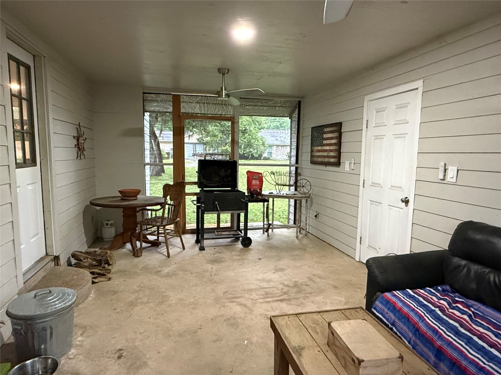 25 Ridge Top Drive Huntsville, TX 77320 - Photo 16 of 19 a view of a workspace with furniture and a window