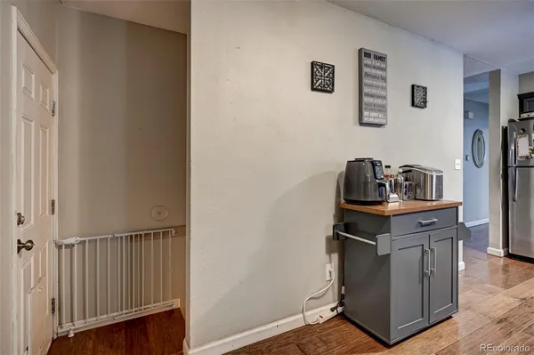 a kitchen with a stove and a refrigerator