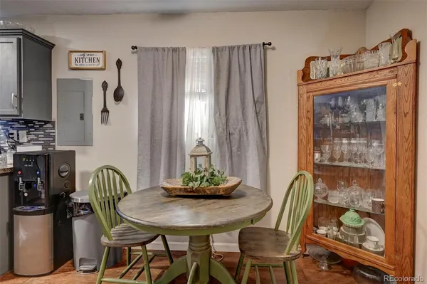 a view of a dining room with furniture and window