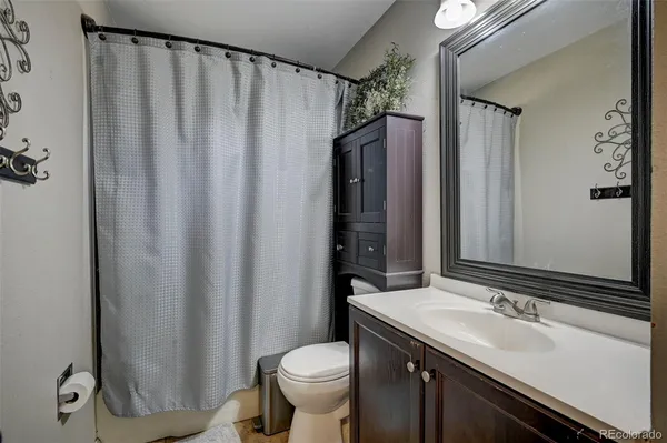 a bathroom with a sink and toilet