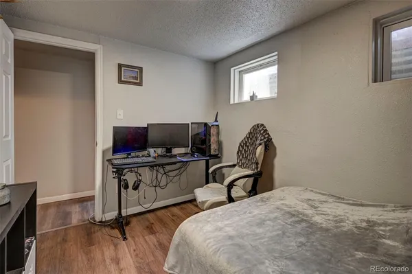 a bedroom with a bed and a television