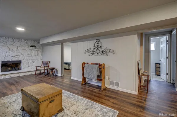 a living room with furniture and a fireplace
