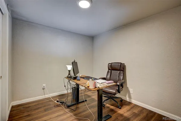a view of a workspace with furniture