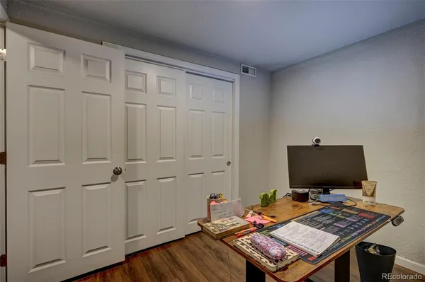 a workspace with furniture and wooden floor