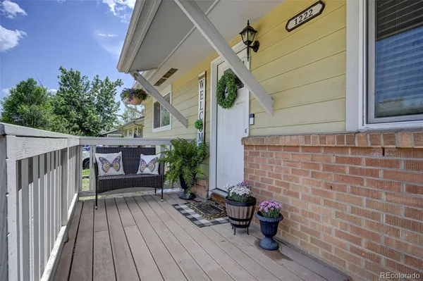 a view of a chairs in patio of house