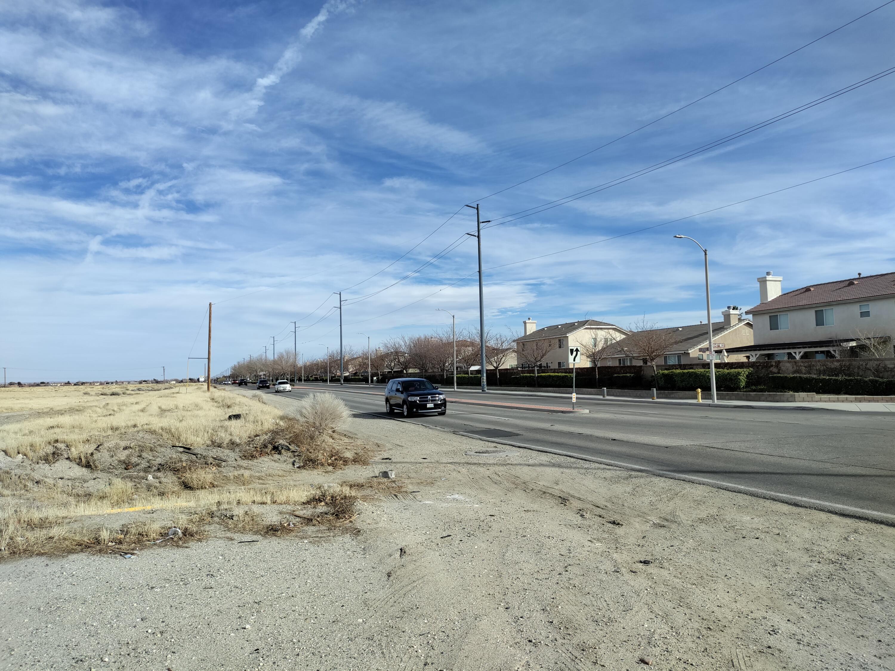 47th Street West Lancaster, CA 93536 - Photo 3 of 3 a view of a road with an empty space