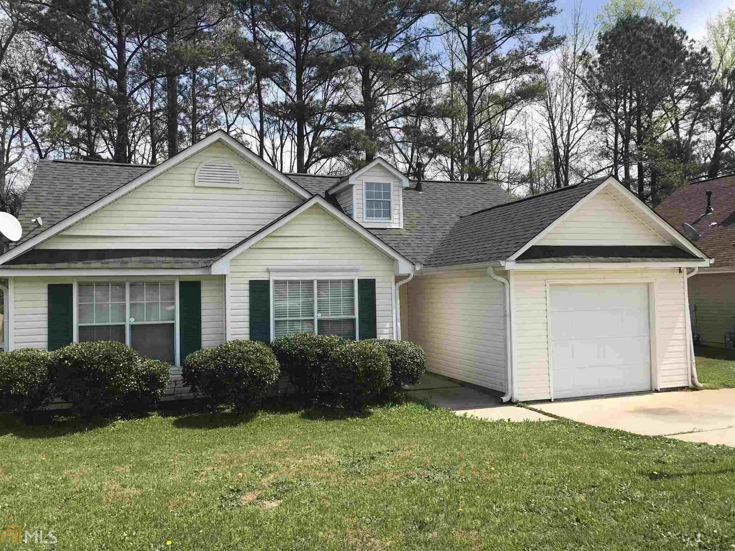 189 Misty Ridge Trail Stockbridge, GA 30281 - Photo 1 of 1 a front view of house with yard and trees around