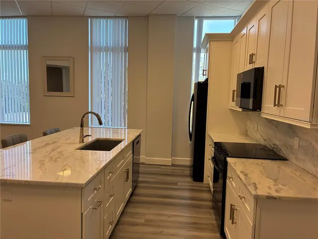 a living room with furniture fireplace and a flat screen tv