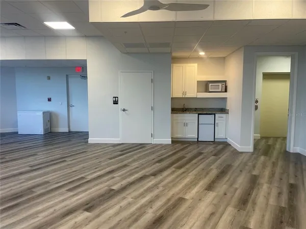 a bathroom with a shower and a sink