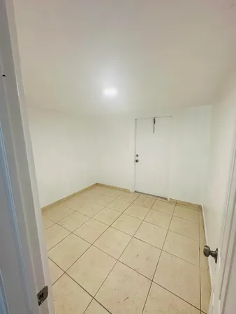 an empty room with a bench