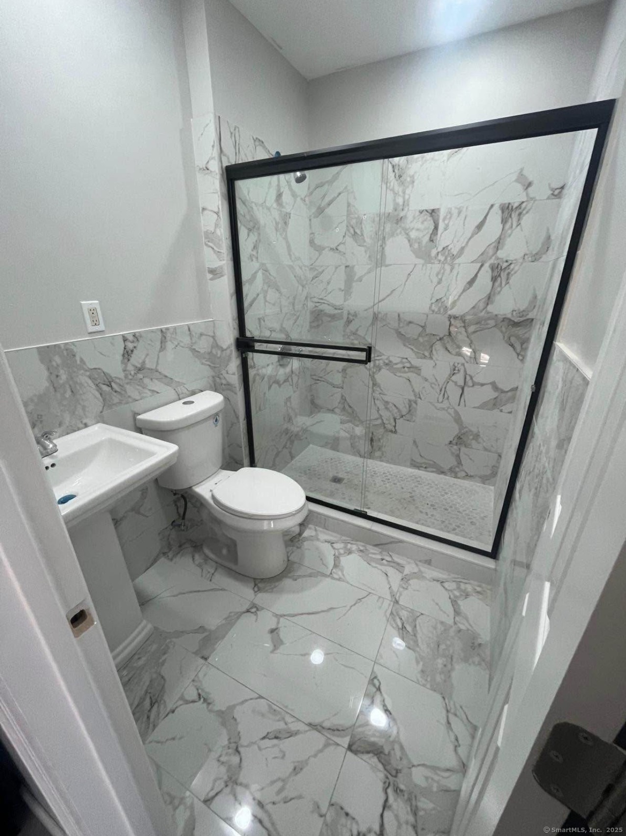 383 Shelton Avenue, Unit 2 New Haven, CT 06511 - Photo 2 of 3 a bathroom with a granite countertop sink toilet and shower