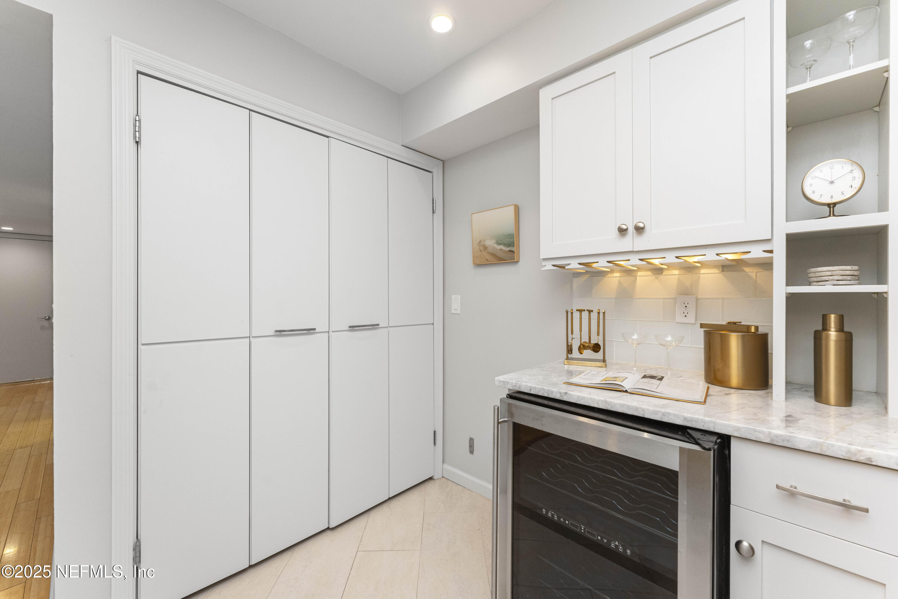 372 4th Street Atlantic Beach, FL 32233 - Photo 15 of 77 a bathroom with a sink and a mirror