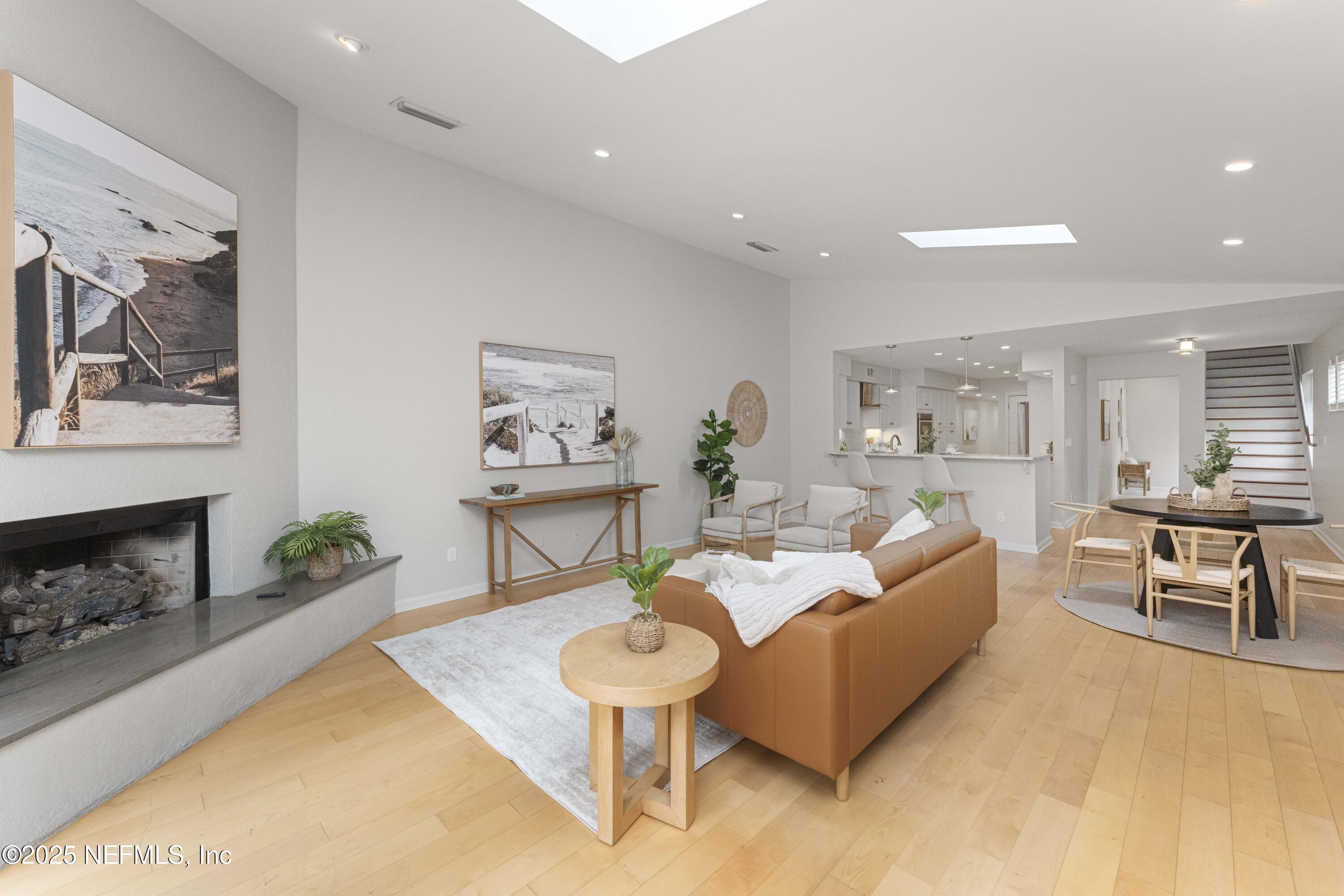 372 4th Street Atlantic Beach, FL 32233 - Photo 20 of 77 a living room with furniture and a fireplace