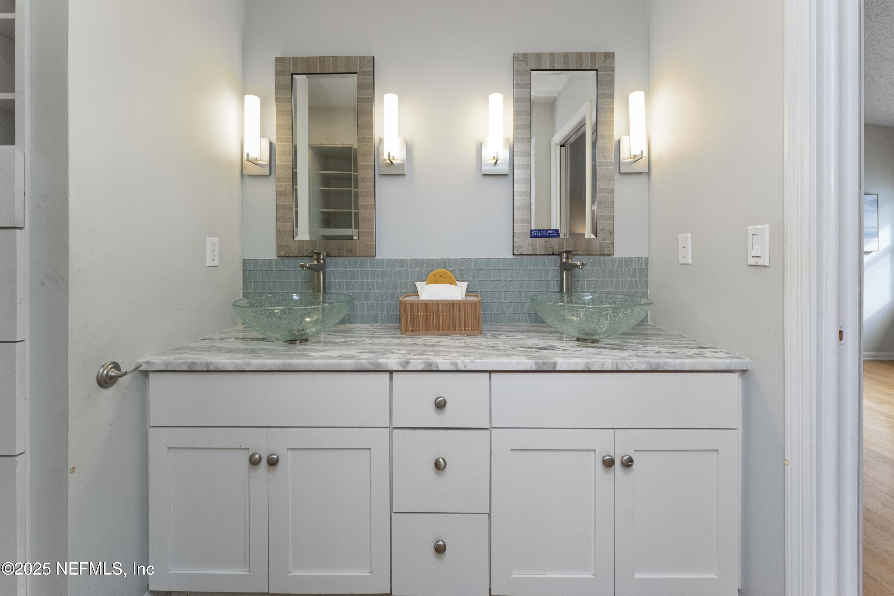 372 4th Street Atlantic Beach, FL 32233 - Photo 29 of 77 a bathroom with cabinets granite and sink
