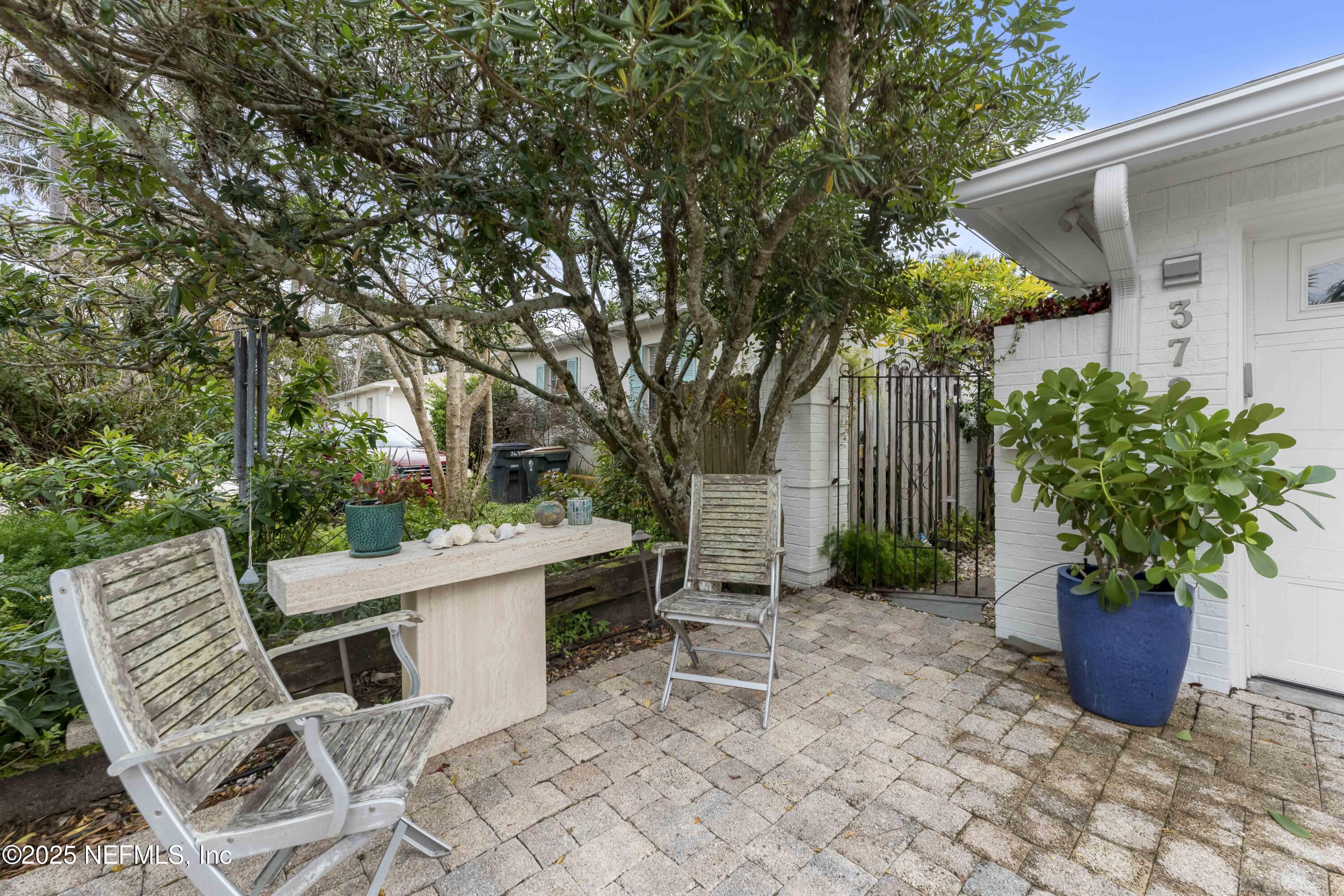 372 4th Street Atlantic Beach, FL 32233 - Photo 5 of 77 a view of a chair and table in backyard of the house