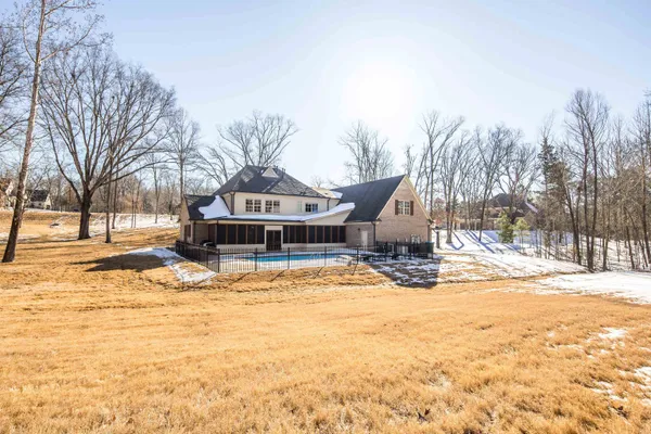 a dining room with furniture and chandelier